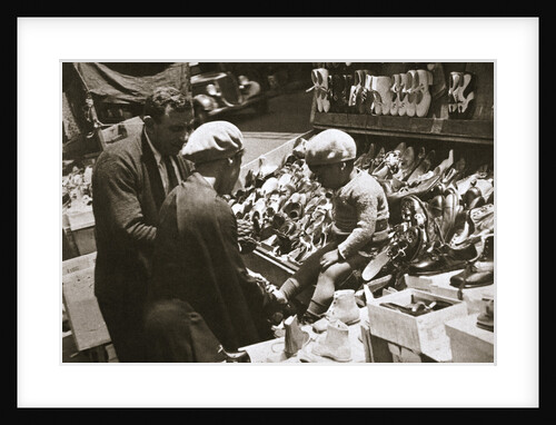 A woman from Harlem buys a pair of shoes for her child by Anonymous