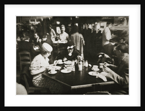 Office workers lunching in a restaurant by Anonymous