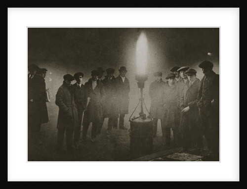 Gathering around an acetylene flare at a traffic control point in the fog by Anonymous