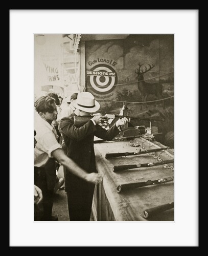 Shooting gallery at the amusement park by Anonymous