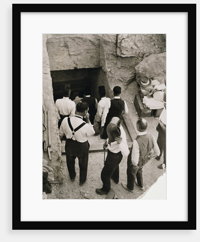 A party going down the steps to the tomb of Tutankhamun by Harry Burton