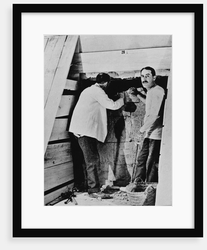 Howard Carter and a colleague excavating a tomb in the Valley of the Kings by Harry Burton