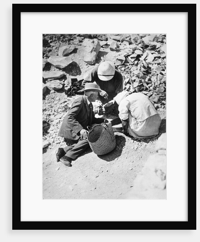 Sifting the dust from the floor of the Tomb of Tutankhamun by Harry Burton