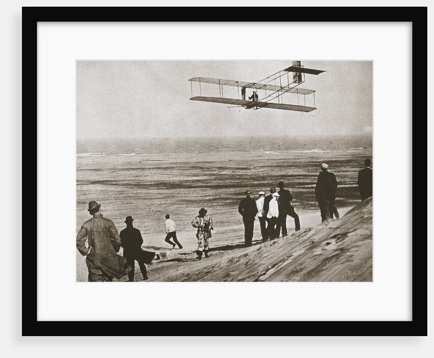 The Wright Brothers testing an early plane at Kitty Hawk by Anonymous