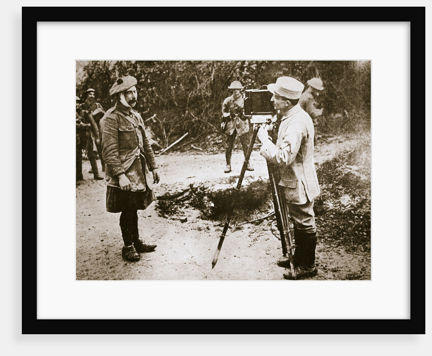 Cameraman filming a wounded soldier by Anonymous