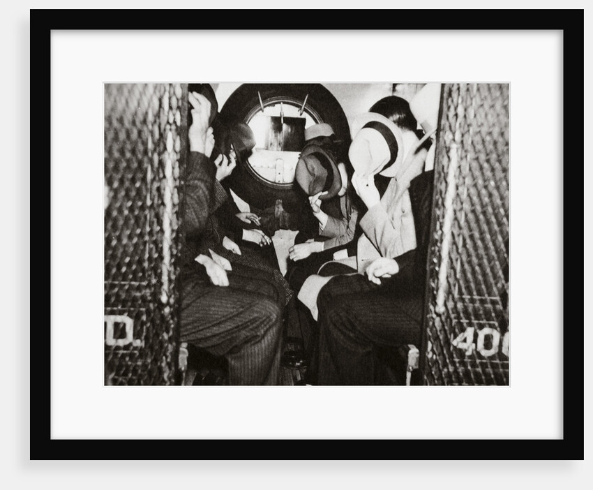 Gangsters in a patrol wagon by Anonymous