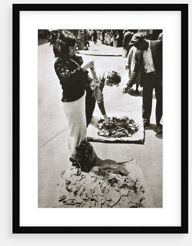 New York street trader selling stockings by Anonymous