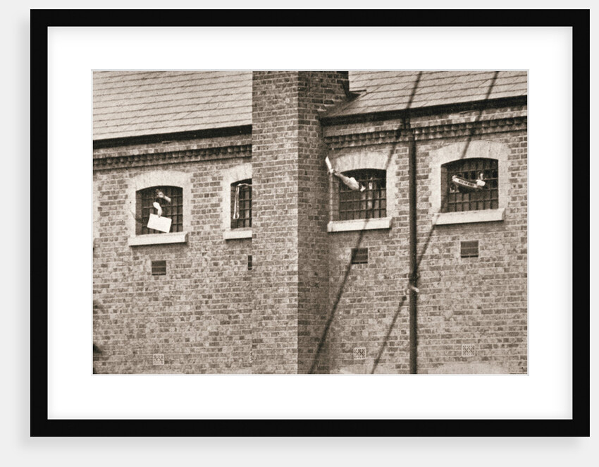 Hunger strikers waving to Christabel Pankhurst from their cells in Holloway Prison by Anonymous