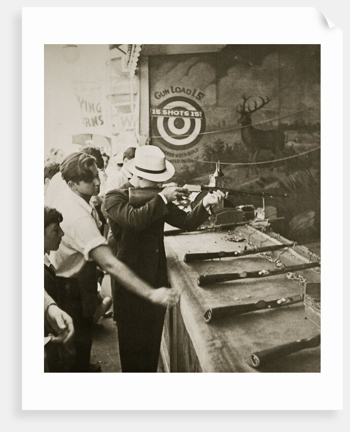 Shooting gallery at the amusement park by Anonymous