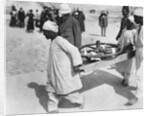 Removing a chariot wheel from the Tomb of Tutankhamun by Harry Burton