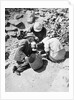 Sifting the dust from the floor of the Tomb of Tutankhamun by Harry Burton