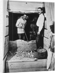 Howard Carter and a colleague excavating a tomb in the Valley of the Kings by Harry Burton