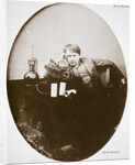 Thomas Alva Edison, American inventor, sitting beside his improved machine by Anonymous