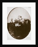 Thomas Alva Edison, American inventor, sitting beside his improved machine by Anonymous
