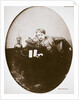 Thomas Alva Edison, American inventor, sitting beside his improved machine by Anonymous