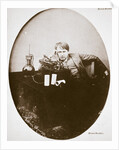 Thomas Alva Edison, American inventor, sitting beside his improved machine by Anonymous