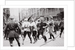 Men in Bolshevik uniform fighting police in the street by Anonymous