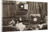 People watching an early television transmission by Anonymous