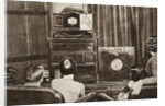 People watching an early television transmission by Anonymous