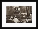 People watching an early television transmission by Anonymous