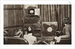 People watching an early television transmission by Anonymous