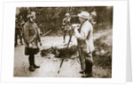 Cameraman filming a wounded soldier by Anonymous