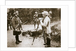 Cameraman filming a wounded soldier by Anonymous