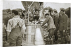 Observer of a kite-balloon testing the telephone before ascending by Anonymous