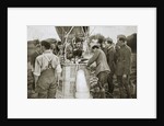 Observer of a kite-balloon testing the telephone before ascending by Anonymous