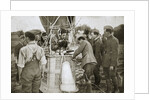 Observer of a kite-balloon testing the telephone before ascending by Anonymous