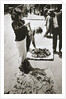 New York street trader selling stockings by Anonymous