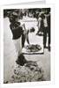 New York street trader selling stockings by Anonymous