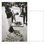 New York street trader selling stockings by Anonymous