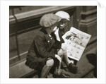 Two boys reading the comic section of the Sunday paper by Anonymous