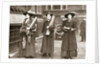 Suffragettes armed with materials to chain themselves to railings by Anonymous