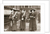 Suffragettes armed with materials to chain themselves to railings by Anonymous