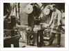 Money making; cutting strips of silver into disks by Anonymous