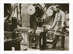 Money making; cutting strips of silver into disks by Anonymous