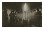 Gathering around an acetylene flare at a traffic control point in the fog by Anonymous