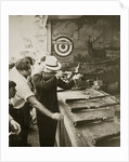 Shooting gallery at the amusement park by Anonymous