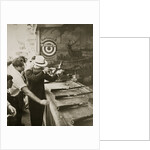 Shooting gallery at the amusement park by Anonymous