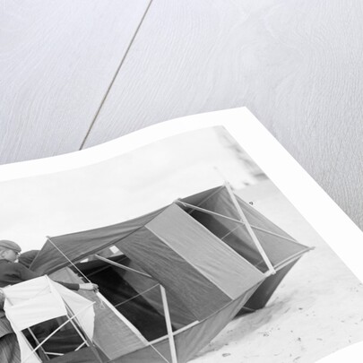 Large black box kite grounded by Andrew Pitcairn-Knowles