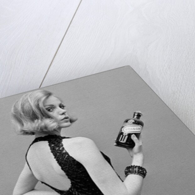 Model holding bottle of poison by John French