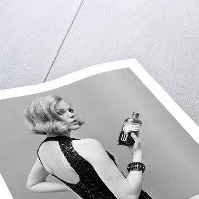 Model holding bottle of poison by John French