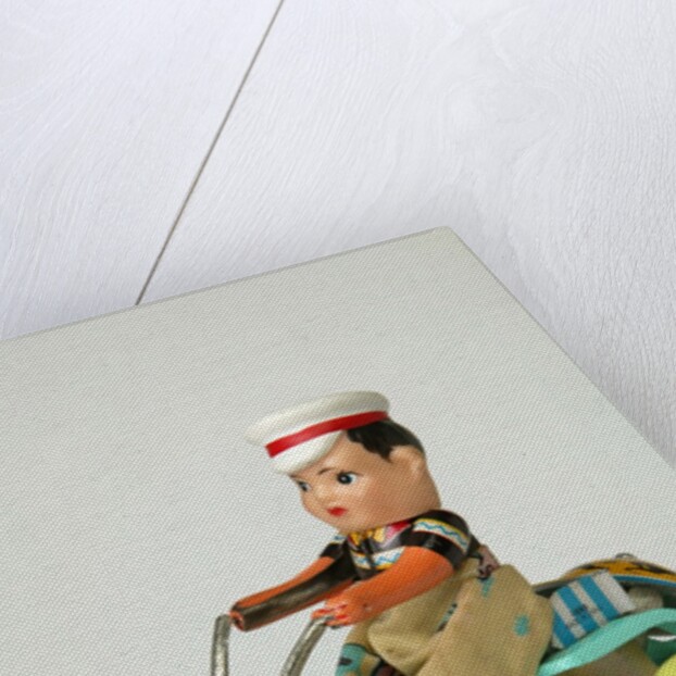 Clockwork toy boy on a tricycle by Unknown