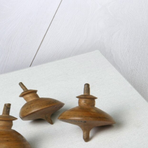 Miniature spinning tops by Unknown