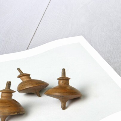Miniature spinning tops by Unknown