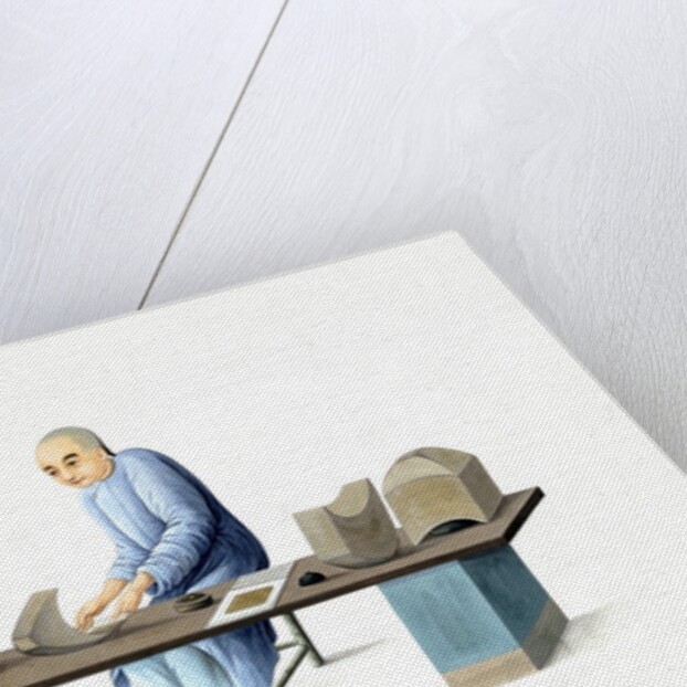 Man making paper ingots by Unknown