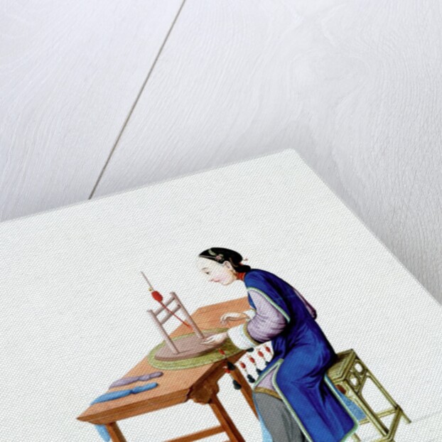 Woman plaiting threads by Unknown