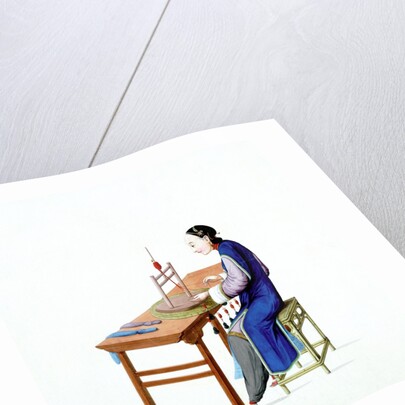 Woman plaiting threads by Unknown